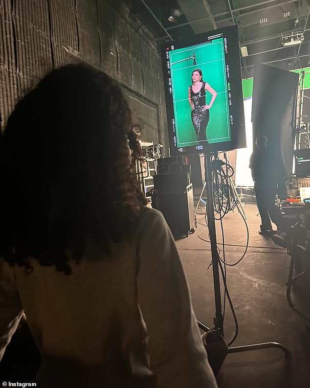 She wrapped the carousel with a behind-the-scenes photo of herself wearing a black sequin dress on set