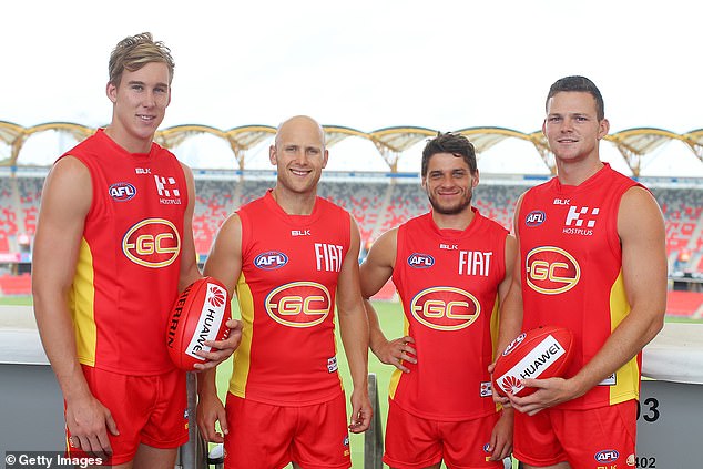 May (right) and Prestia (second from right) both played together at Gold Coast and joined the Suns in 2010