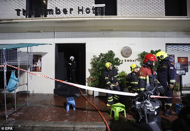 Firefighters at the scene of a fire at the Ember Hotel in Bangkok