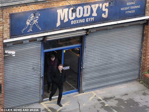 In other photos, Tom was seen emerging from a building with the sign 'Moody's Boxing Gym'