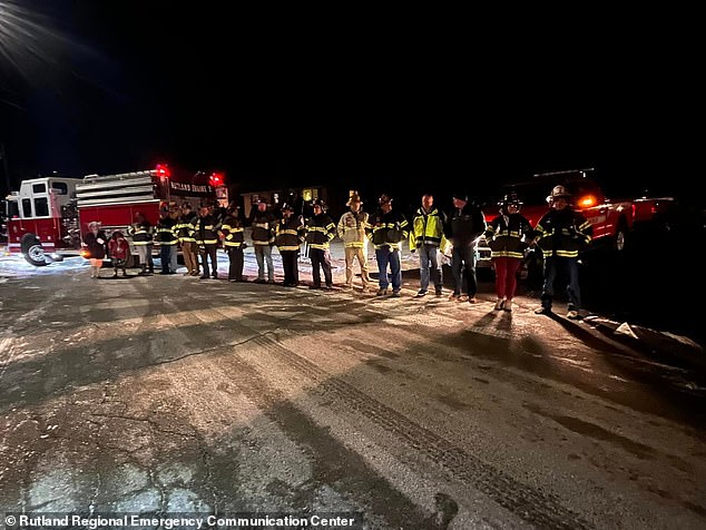 Sullivan's fire department colleagues lined up to support him as he returned home after the deaths of his wife and twins.