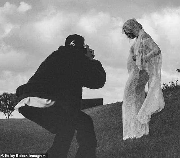 In their post, Hailey, 28, wore a long white lace dress and veil from Saint Laurent as they paired the announcement with a vow renewal in Hawaii.