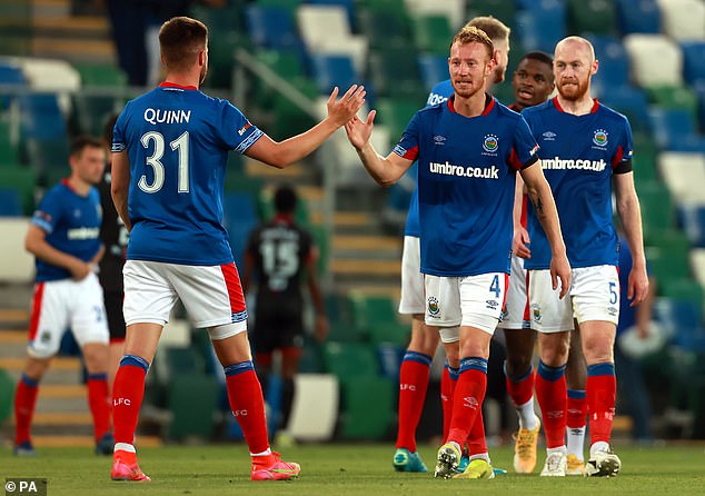 The defender played for both Linfield (pictured) and Cliftonville in Northern Ireland