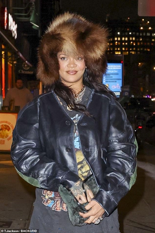 For her outing, she wore a vintage and distressed Tupac T-shirt, which she paired with a cropped button-up leather jacket