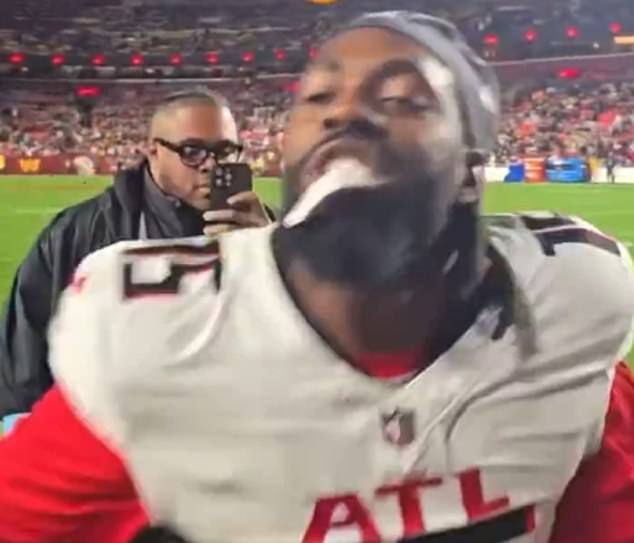 The pass rusher appeared to punch a fan's phone after being harassed on the sideline