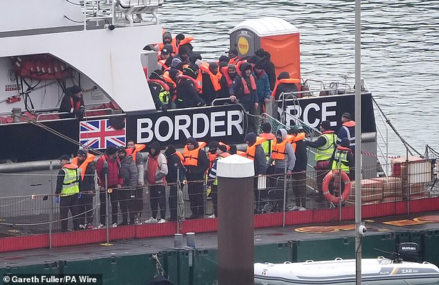 A group of people believed to be migrants are taken from a Border Force ship to Dover, Kent, on December 29, 2024, following a minor boating incident in the Channel.