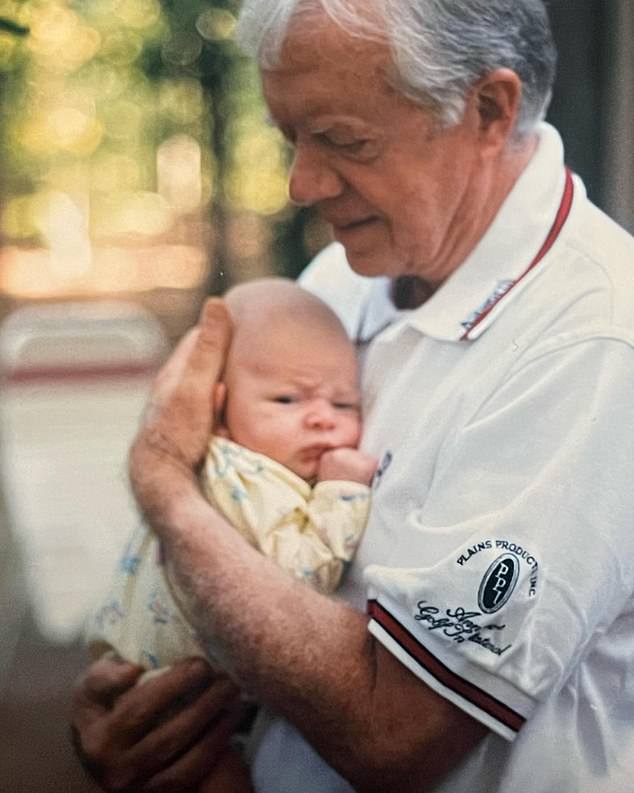 An image Wentzel shared in a post of his grandfather holding him after it was announced that President Carter had died. Wentzel captioned the post that his Paw-Paw was the 