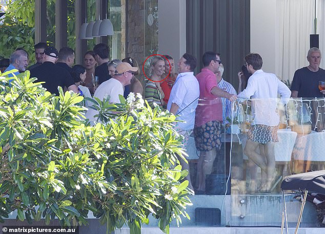 Significantly, Michael's ex-girlfriend Jade Yarbrough (circled) was at the party. She is seen here talking to her brother-in-law Karl