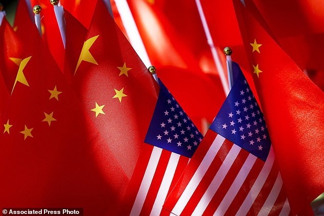 American flags are shown with Chinese flags on top of a pedicab