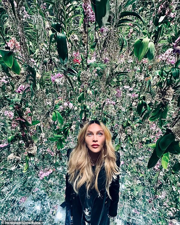 The couple also stopped by a room full of mirrors and plants and took photos of each other in awe of the exhibit