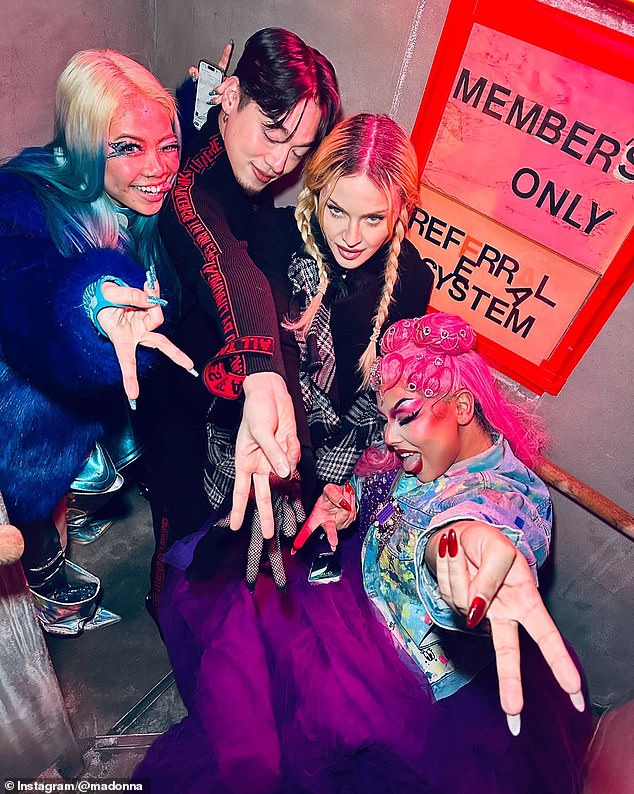 Her post also included a photo of her posing with drag queens and throwing up peace signs