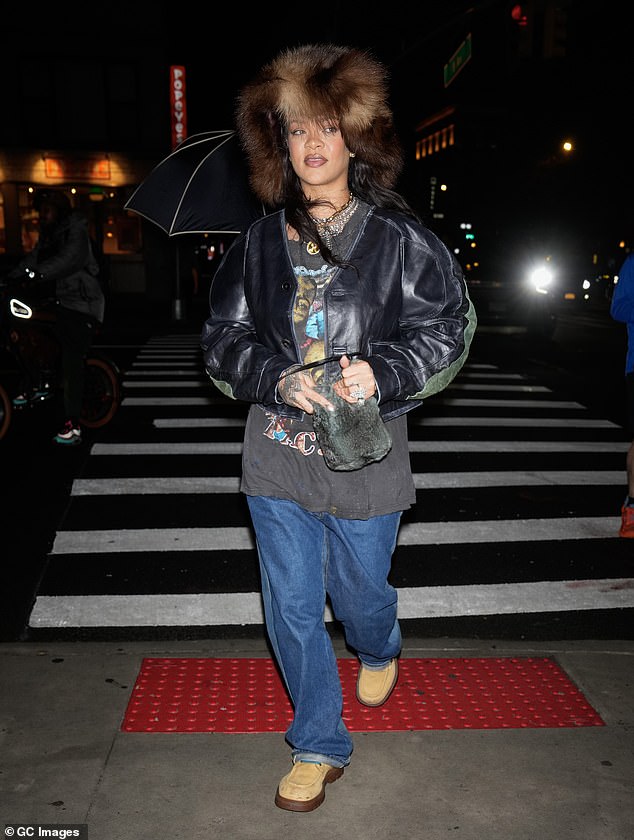 At the event, Rihanna rocked an oversized fur hat, graphic Tupac shirt, jeans and Bottega Veneta boots, retailing for $1,400