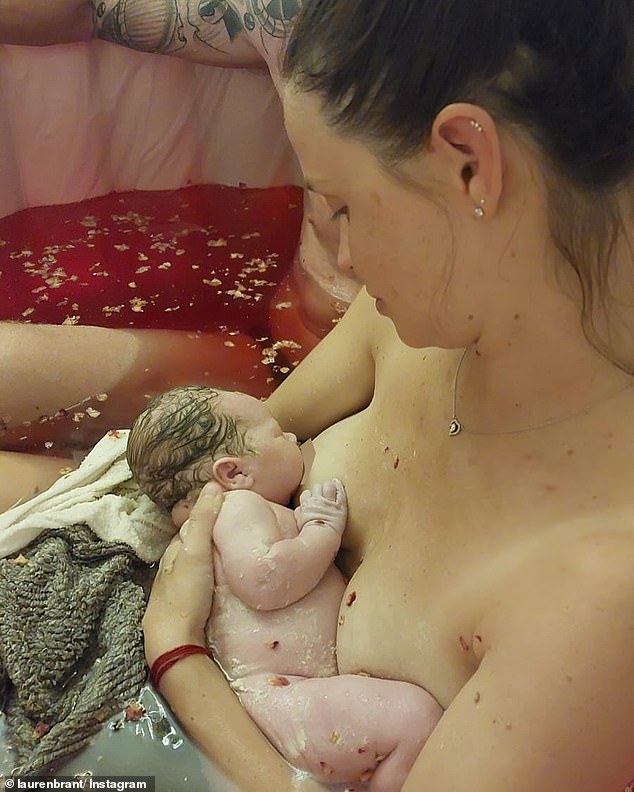 The graphic images showed Lauren cradling the newborn while in a birthing pool