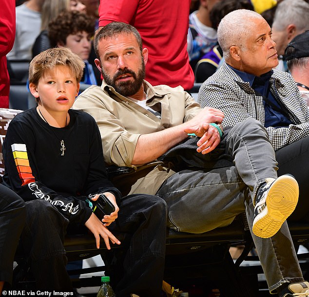 While Lopez spent Christmas with her family in Aspen, Colorado, Affleck spent it with Garner and their children, according to People; seen with son Samuel, 12, in November