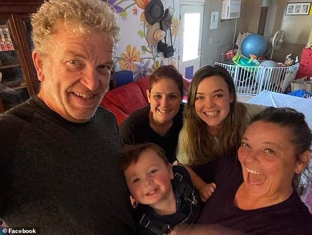 Paul is seen alongside his wife Christine, daughters Sabrina and Samanatha and his young grandson