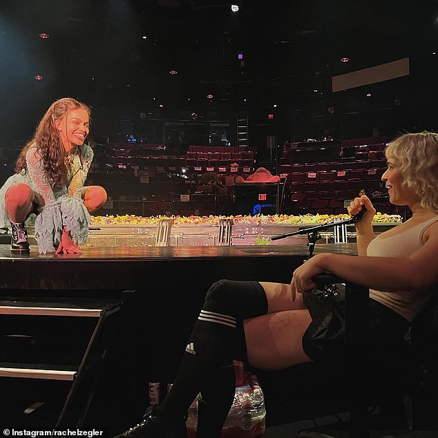 The second photo was of her adorable interaction with Tommy Dorfman, her co-star in the Broadway play, as she stood on stage and made a playful face at the 32-year-old actress sitting off to the side.