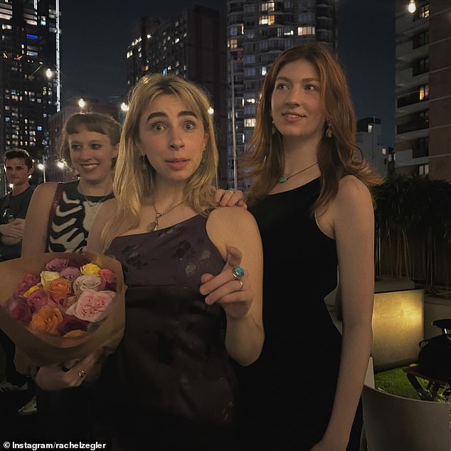 She also posted a photo of her friends, Makena Reynolds and Ava Whiteley, at what appeared to be a late-night get-together on the city's rooftop.