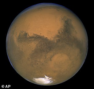 Mars (pictured) is moving steadily west and you can usually recognize it by its distinctive color, but also by its distinct lack of sparkle. Pictured: A close-up of Mars as captured by the Hubble spacecraft