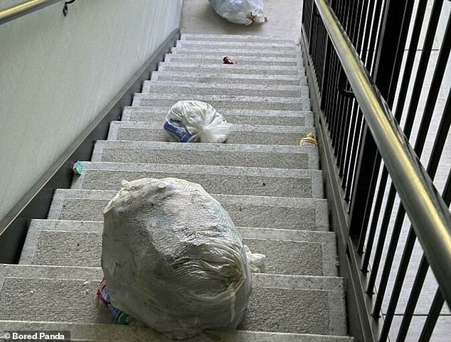 Garbage neighbors! This resident noticed that the neighbor decided to throw his garbage bags down the stairs instead of in the trash can