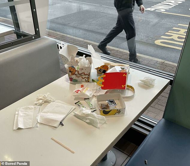 A disaster during the meal! This parent clearly didn't have time to take her trash to the dumpster at McDonald's