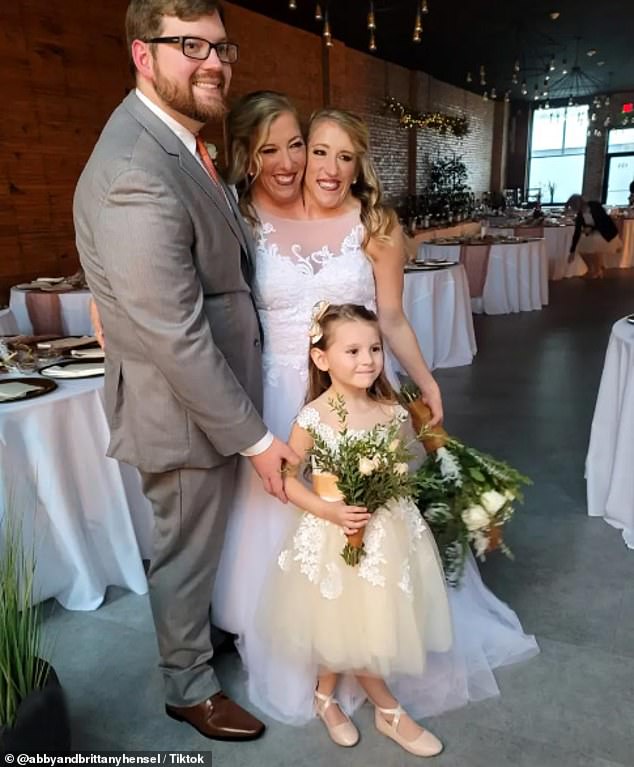 They currently both teach fourth and fifth grade at a local elementary school, where they share the same salary because they teach the same classes. Pictured with Abby's husband Josh Bowling