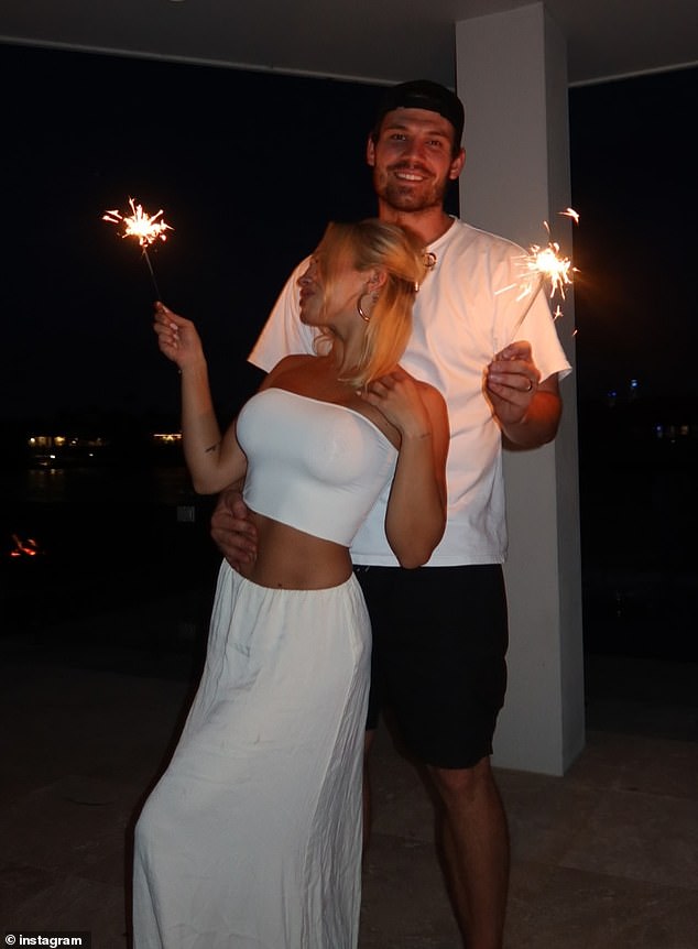 The blonde beauty shared a series of photos to Instagram to mark the occasion and could be seen cuddling with her boyfriend as she celebrated the end of the year with sparklers.