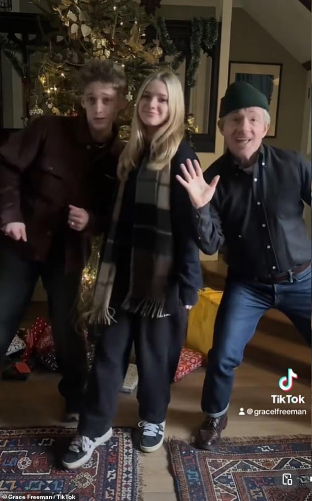 In a particularly funny part of the video, Grace stood in front of a glittering Christmas tree as she lip-synced, before her brother Joe and father Martin entered the picture to be her backup singers.