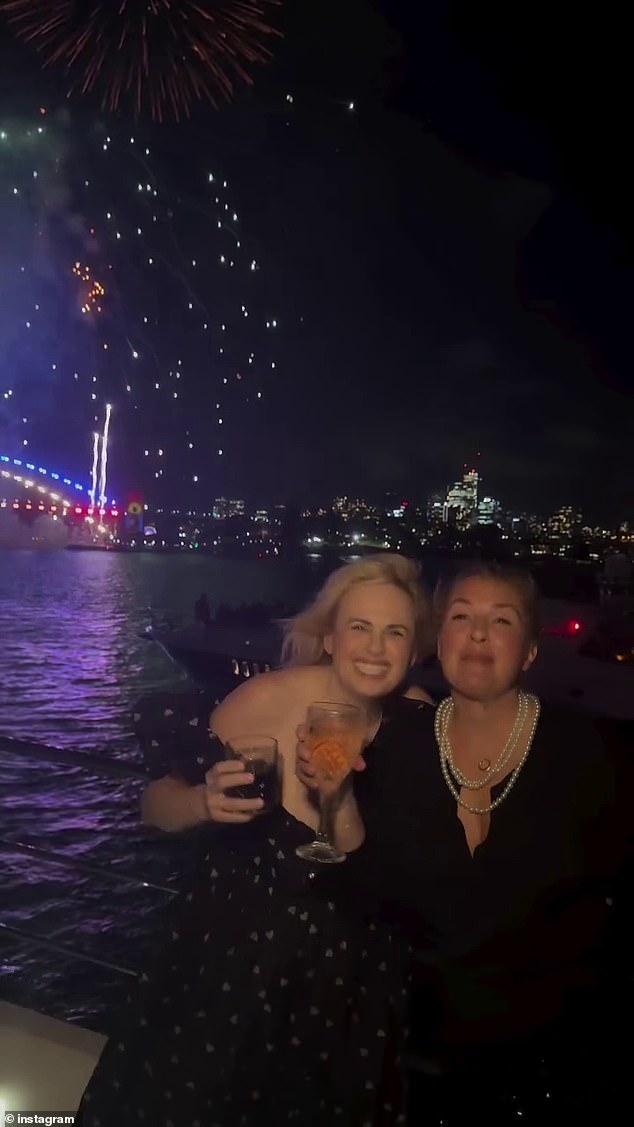 The couple shared a sweet kiss as fireworks exploded above them in Sydney Harbour