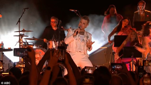 Robbie completed the set with Rock DJ, a cover of John Farnham's You're The Voice and his hit single Angels, before an excited countdown to the epic midnight fireworks display on Sydney Harbor