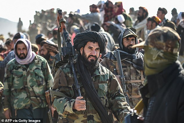 Taliban security personnel gather at the site two days after airstrikes by Pakistan in the Barmal district of eastern Paktika province on December 26, 2024