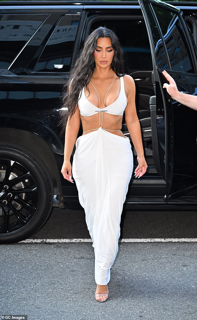 Kim also showed some skin in this white dress in Midtown Manhattan on August 14, 2024