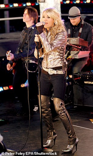 Carrie showed up in Times Square in 2007 wearing a gold lace-up leather jacket