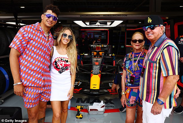 In 1973, Walton Laurie graduated with a bachelor's degree in English from the University of Memphis, where she met her future husband, Bill Laurie (right). Pictured: Patrick Mahomes, Brittany Mahomes, Nancy Walton Laurie and Bill Laurie pose for a photo outside the Red Bull Racing garage in Miami, Florida