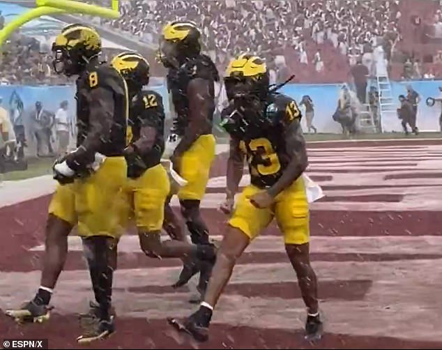 The cameraman tried to film Michigan's victory celebration on Tuesday