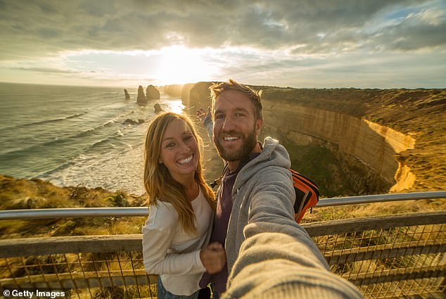 Victoria's new 7.5 per cent tax on short-term accommodation, including Airbnb, will come into effect on January 1 in a bid to raise $60 million (pictured is a young couple at the Twelve Apostles on the Great Ocean Road)