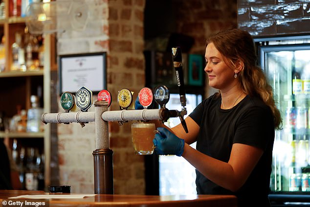 New Year's Day will also see a 3 per cent increase in the minimum wage in the aged care sector, including salaries previously covered by the nurses award and those covered by the social, community, home care and disability care award (pictured is a bartender from Bunbury in Western Australia)