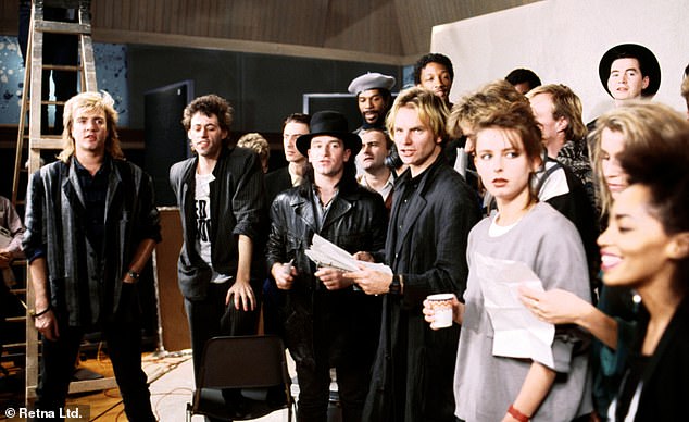 Bob Geldof (second from left) and the crème de la crème of rock and pop record the 1984 single