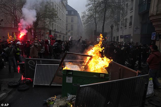 Barricades made of metal planks, rubbish bins and fires were hastily erected in Paris as police responded to protesters in April last year