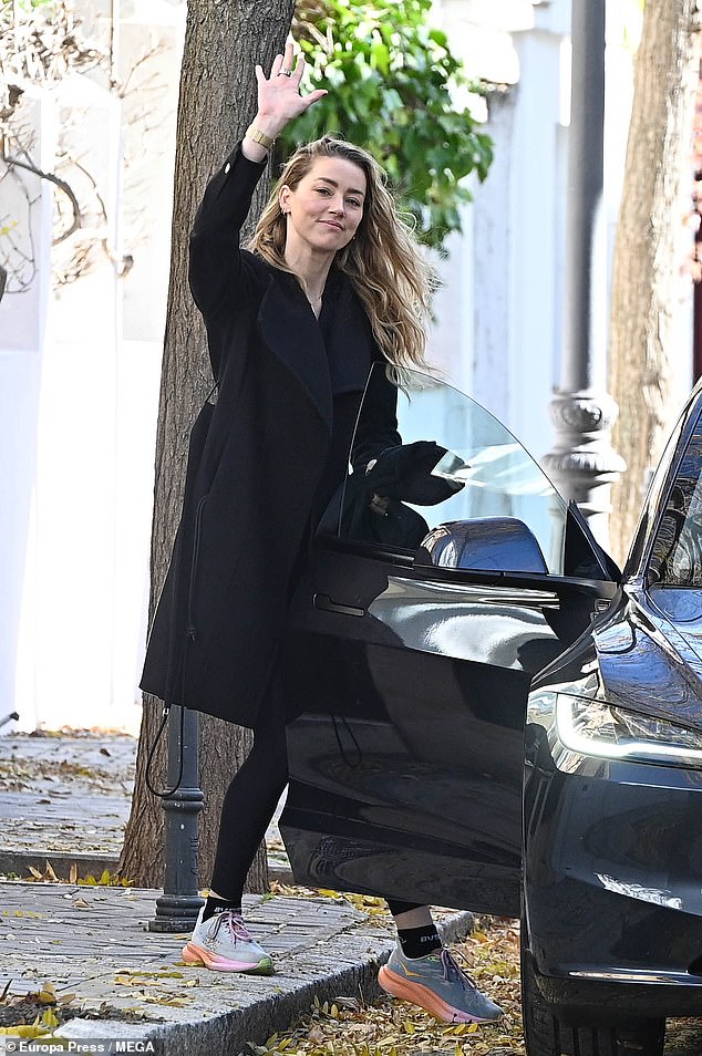 Amber Heard beamed as she was spotted in Madrid for the first time since announcing her pregnancy on Saturday