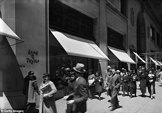 People walk past the Lord & Taylor store on Fifth Avenue in 1935