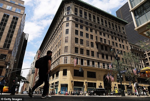 People walk past the former Lord & Taylor's flagship store on 5th Avenue in Manhattan in 2018