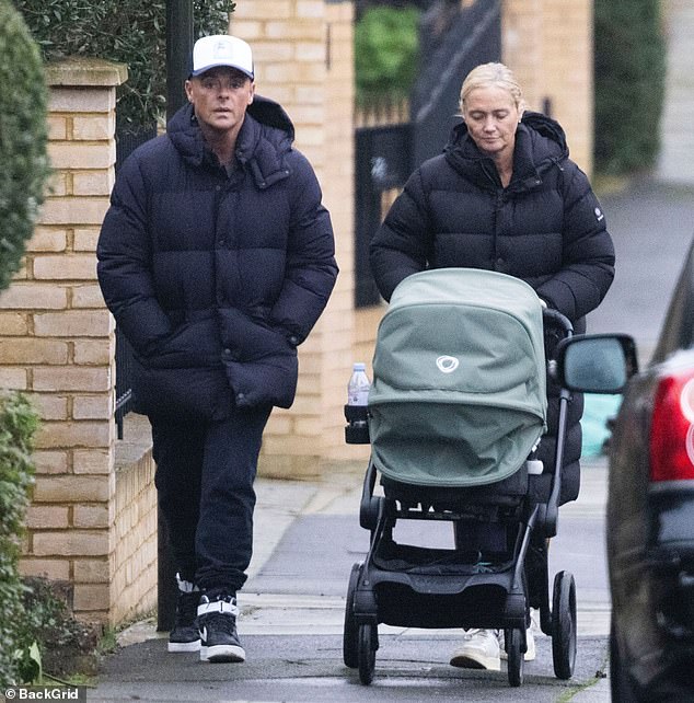 Ant McPartlin, 49, and his wife Anne-Marie dressed warmly as they took their son Wilder for a walk in Wimbledon on Friday