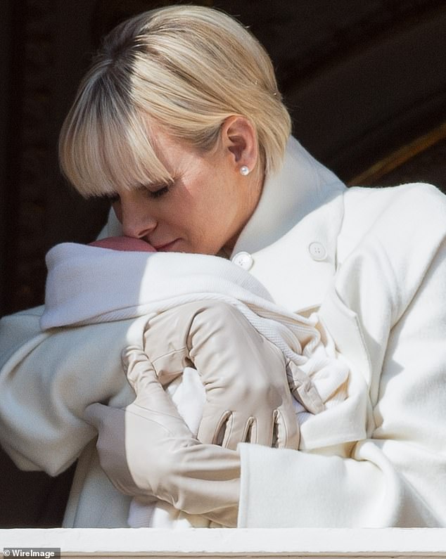 Princess Charlene holds Princess Gabriella on the balcony of Monaco Palace on January 7, 2015