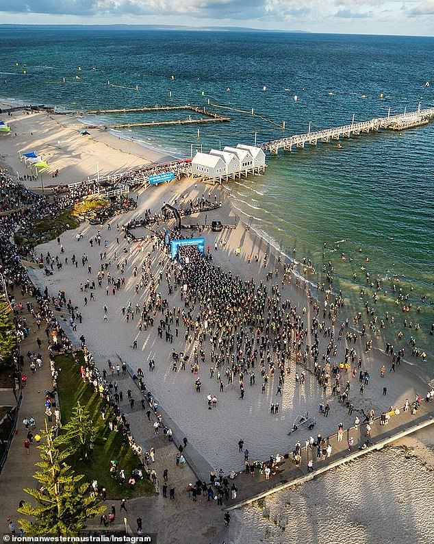 An athlete died on Sunday after suffering a medical problem during the swimming event of the world-famous Busseltown Ironman endurance race (pictured) in Washington