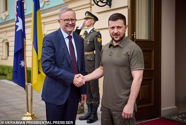 Ukrainian President Volodymyr Zelenskiy (right) and Australian Prime Minister Anthony Albanese (left) shake hands before a meeting at the NATO summit in Lithuania in July 2023