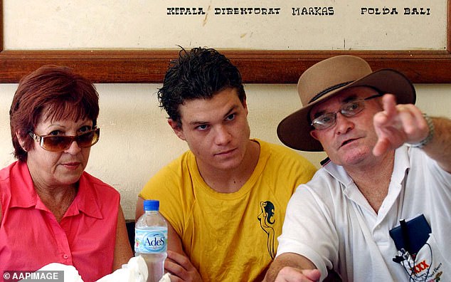 Scott Rush (center) is pictured with his parents Christine and Lee in Indonesia in 2006