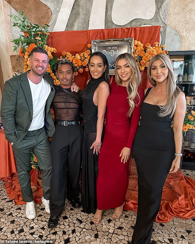 Justin McKeone (left) puts his arm around former Masterchef contestant Khanh Ong. Tahnee Leeson of Bachelor Australia 2021, who posted the image a few days ago, is dressed in red