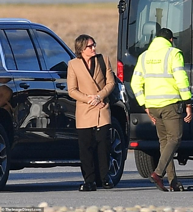 Keith Urban wore a feminine camel winter coat during his trip to New York on a private jet