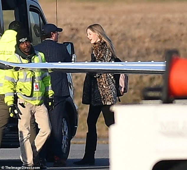 Nicole and Keith's daughter Sunday Rose, 16, pictured leaving the private jet wearing a cheetah print faux fur coat and carrying a pink backpack