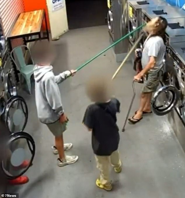 Four boys used broomsticks to attack a disabled man in a launderette in south-east Queensland